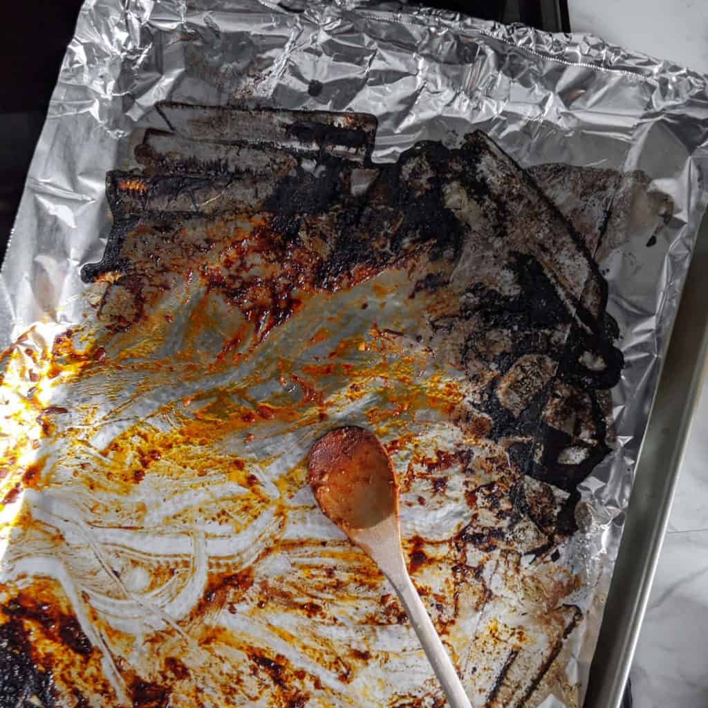 Baking sheet covered with aluminium foil burnt